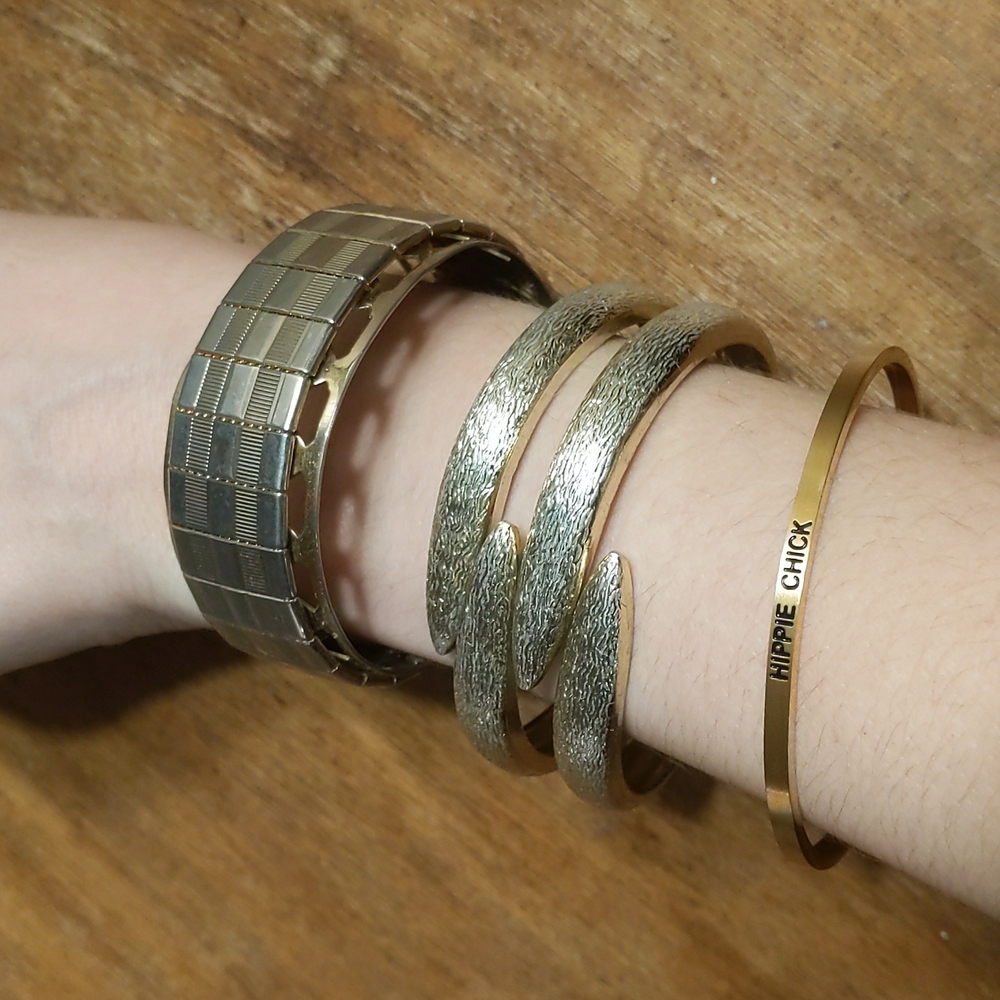 Three Gold Tone Bracelets